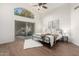 Airy main bedroom with a large arched window, sliding glass door, and wood-look floors at 1591 S Sycamore Pl, Chandler, AZ 85286