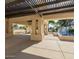 Relaxing outdoor space featuring a fountain, seating, and a covered pergola at 1591 S Sycamore Pl, Chandler, AZ 85286