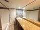 Bathroom showcasing granite counters and a large mirror spanning the vanity and shower area at 1702 W Tuckey Ln # 209, Phoenix, AZ 85015