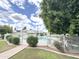 A community pool area with safety fence and lounge chairs offers a great way to cool off at 1702 W Tuckey Ln # 209, Phoenix, AZ 85015