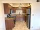 Modern kitchen with granite countertops, stainless steel appliances, and tile backsplash at 1702 W Tuckey Ln # 209, Phoenix, AZ 85015