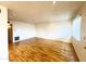 Spacious living room featuring gleaming hardwood floors and ample natural light at 1702 W Tuckey Ln # 209, Phoenix, AZ 85015