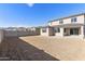 Expansive backyard with block fencing, offering a blank canvas for creating a personalized outdoor living space at 19033 W Rose Ln, Waddell, AZ 85355