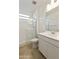 Bathroom featuring a glass-enclosed shower, toilet, and single sink at 19033 W Rose Ln, Waddell, AZ 85355