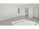 Bright and airy bedroom with neutral carpeting and an ensuite bathroom, offering both comfort and convenience at 19033 W Rose Ln, Waddell, AZ 85355