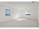 Spacious bedroom with neutral carpet, bright windows and recessed lighting at 19033 W Rose Ln, Waddell, AZ 85355