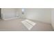 Large bonus room with neutral carpet and natural light at 19033 W Rose Ln, Waddell, AZ 85355