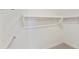 Walk-in closet with rods and carpet at 19033 W Rose Ln, Waddell, AZ 85355
