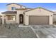 Charming two-story home with tile roof, stucco exterior, and a two-car garage at 19033 W Rose Ln, Waddell, AZ 85355