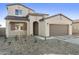 A charming two-story home with a two-car garage, neutral color palette, and minimal landscaping at 19033 W Rose Ln, Waddell, AZ 85355