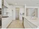 Modern kitchen with a large island, stainless steel appliances, and ample counter space at 19033 W Rose Ln, Waddell, AZ 85355