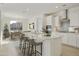 Bright, open kitchen with quartz countertops, a large island, and stainless steel appliances at 19033 W Rose Ln, Waddell, AZ 85355