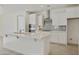 Bright kitchen featuring stainless steel appliances, gas cooktop, and ample counter space at 19033 W Rose Ln, Waddell, AZ 85355