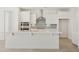 Well lit kitchen featuring a large island and stainless steel appliances at 19033 W Rose Ln, Waddell, AZ 85355