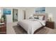 Serene main bedroom featuring a comfortable bed, soft lighting, and decorative wall art, perfect for relaxing at 19033 W Rose Ln, Waddell, AZ 85355