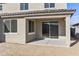 Covered patio featuring concrete flooring and direct access to backyard, perfect for outdoor entertaining and relaxation at 19033 W Rose Ln, Waddell, AZ 85355