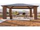 Community picnic area with grills, seating and desert landscaping near new construction homes at 19033 W Rose Ln, Waddell, AZ 85355