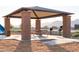 Community picnic area with grill, seating and desert landscaping near a community playground at 19033 W Rose Ln, Waddell, AZ 85355