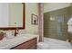 Charming bathroom with a granite countertop, stylish mirror, and tiled shower/tub combination at 19420 W San Juan Ave, Litchfield Park, AZ 85340