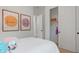 Cozy bedroom with soft decor, artwork, and a closet with ample storage space at 19420 W San Juan Ave, Litchfield Park, AZ 85340