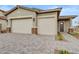 Charming home featuring a two-car garage and an attractive brick driveway and pillars for a sophisticated look at 19420 W San Juan Ave, Litchfield Park, AZ 85340
