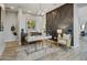 Stylish home office space featuring a modern desk, comfortable chair, and custom accent wall for added elegance at 19420 W San Juan Ave, Litchfield Park, AZ 85340