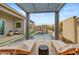 Inviting backyard pool featuring comfortable lounge chairs under a modern pergola at 19420 W San Juan Ave, Litchfield Park, AZ 85340