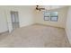 Spacious bedroom featuring a ceiling fan and two windows for natural light at 19432 W Morning Glory Dr, Buckeye, AZ 85326