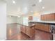 Bright kitchen with an island, stainless appliances, granite counters, and an open layout at 19432 W Morning Glory Dr, Buckeye, AZ 85326
