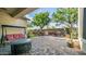 Brick-paved patio with comfortable seating, outdoor kitchen and BBQ, creating an ideal space for outdoor dining at 1970 E Yellowstone Pl, Chandler, AZ 85249