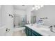 Bright bathroom with tiled floor, double vanity, and a shower/tub combo with glass door, offering a modern design at 1970 E Yellowstone Pl, Chandler, AZ 85249