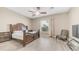 Spacious bedroom with a dark wood bed frame and matching furniture, and large windows at 1970 E Yellowstone Pl, Chandler, AZ 85249