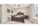 A beautiful bedroom featuring dark wood furniture and bright natural light at 1970 E Yellowstone Pl, Chandler, AZ 85249