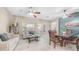 Open concept living and dining area with tile floors and modern ceiling fans at 1970 E Yellowstone Pl, Chandler, AZ 85249