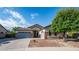 Charming single-Gathering home featuring a three-car garage, neutral color scheme, and stone accents at 1970 E Yellowstone Pl, Chandler, AZ 85249