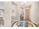 Grand entryway with a decorative tile design and elegant lighting fixture at 1970 E Yellowstone Pl, Chandler, AZ 85249
