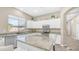 Bright kitchen with stainless steel appliances, granite countertops, and a central island with seating at 1970 E Yellowstone Pl, Chandler, AZ 85249