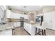 Open-concept kitchen with granite counters, stainless appliances, a breakfast bar, and ample cabinet space at 1970 E Yellowstone Pl, Chandler, AZ 85249