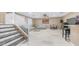 Expansive living room with high ceilings, tile floors, modern furniture, and a staircase leading to upper level at 1970 E Yellowstone Pl, Chandler, AZ 85249