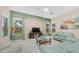Bright living room featuring stylish sofas, a glass coffee table, and large windows at 1970 E Yellowstone Pl, Chandler, AZ 85249