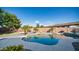 Backyard pool featuring rock waterfall and lush landscaping for ultimate relaxation and privacy at 1970 E Yellowstone Pl, Chandler, AZ 85249