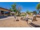 Wide backyard with trampoline and fire pit, perfect for entertaining at 21188 N Duncan Dr, Maricopa, AZ 85138
