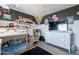 Bedroom with a bunk bed, lots of decorations, black accent wall, window with blinds, dresser and chair at 21188 N Duncan Dr, Maricopa, AZ 85138