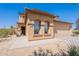 Inviting two-story home with a well-maintained exterior, arched window details, and a charming entrance at 21188 N Duncan Dr, Maricopa, AZ 85138