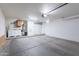 Spacious garage with ample storage, utility sink, and high ceilings, providing convenience and functionality at 21188 N Duncan Dr, Maricopa, AZ 85138