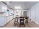 Bright, open kitchen with white cabinets, modern appliances, and a central island with seating at 21188 N Duncan Dr, Maricopa, AZ 85138