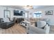Cozy living room with comfortable seating, rustic coffee table, and entertainment center at 21188 N Duncan Dr, Maricopa, AZ 85138