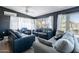 Inviting living room with cozy seating, large windows, and stylish decor at 21188 N Duncan Dr, Maricopa, AZ 85138