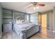 Elegant main bedroom with decorative bed frame, complemented by stylish furnishings at 21188 N Duncan Dr, Maricopa, AZ 85138