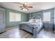 Unique main bedroom featuring a decorative bed frame and stylish furnishings at 21188 N Duncan Dr, Maricopa, AZ 85138